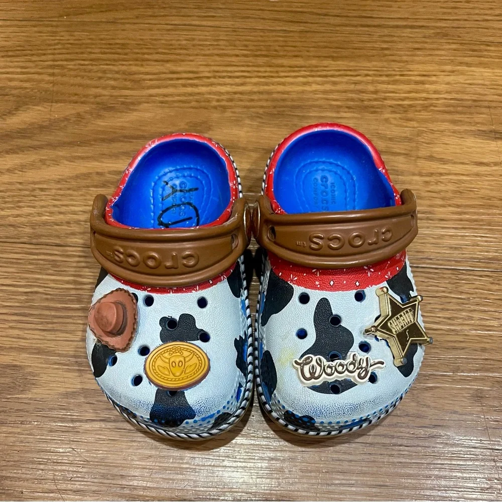 CROCS Kids Woody Cow Print Clogs in White, Black & Brown